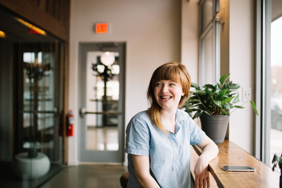 New business owner smiling inside her store