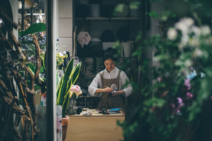 Small business owner standing in her shop