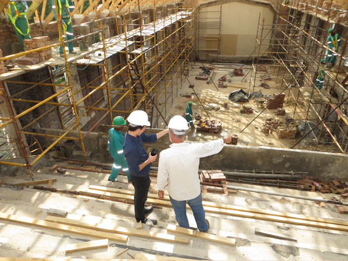 Contractors reviewing a construction site